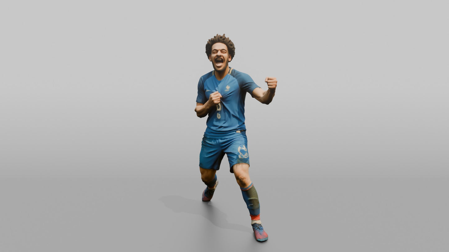 French Player Grabbing His Jersey Crest in Triumph