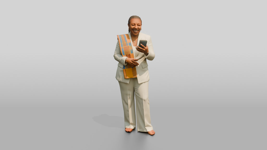 African Woman in a White Pantsuit Laughing at Her Phone