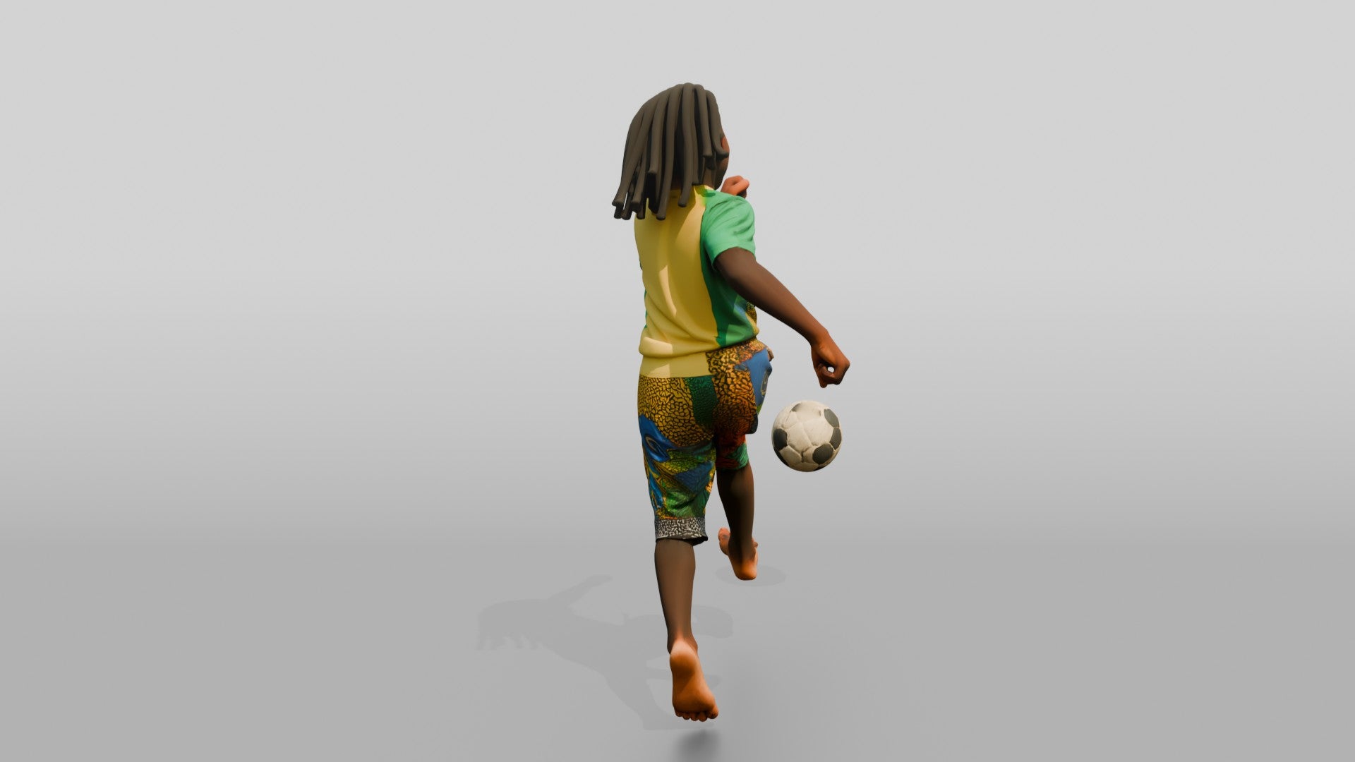 African Boy Playing Soccer in Patchwork Shorts
