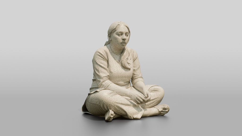 Homeless Woman Looking Dazed While Sitting Low to the Ground