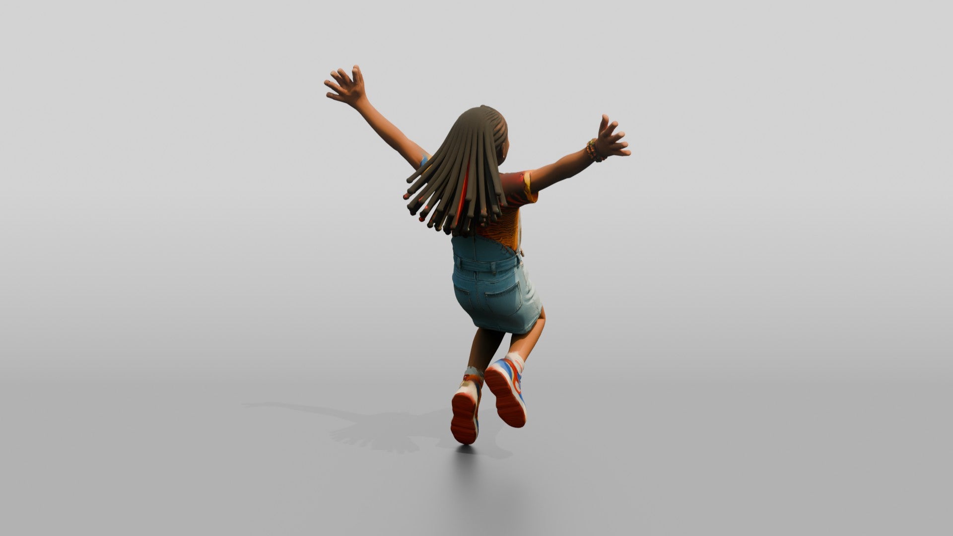 African Girl Jumping Excitedly in a Denim Overall Dress