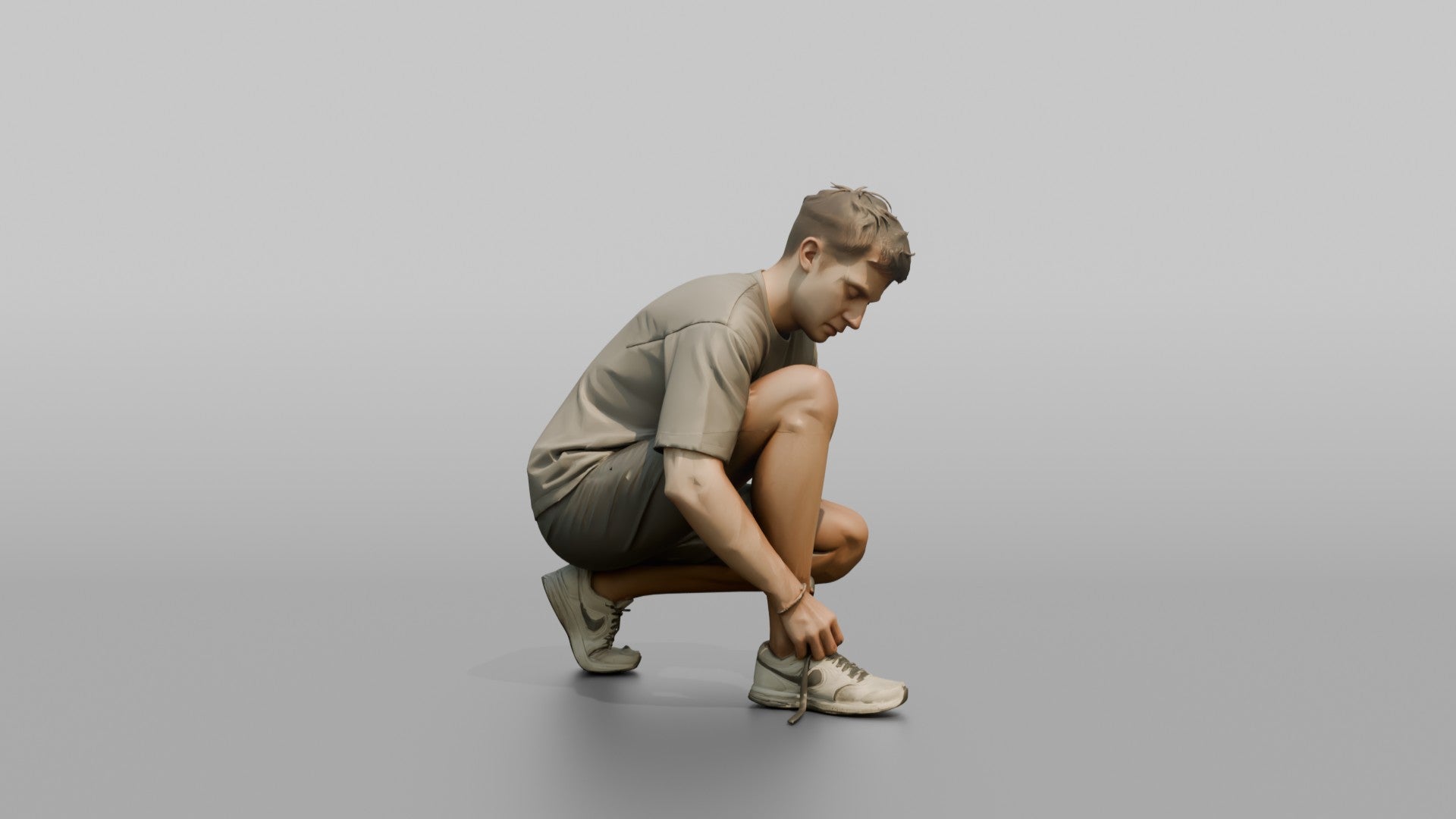 Man Crouching to Retie His Sneakers