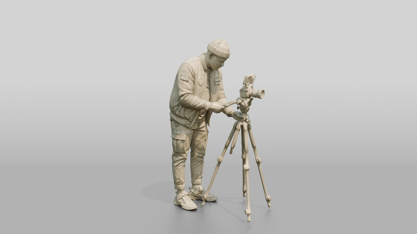 Videographer Setting Up a Camera