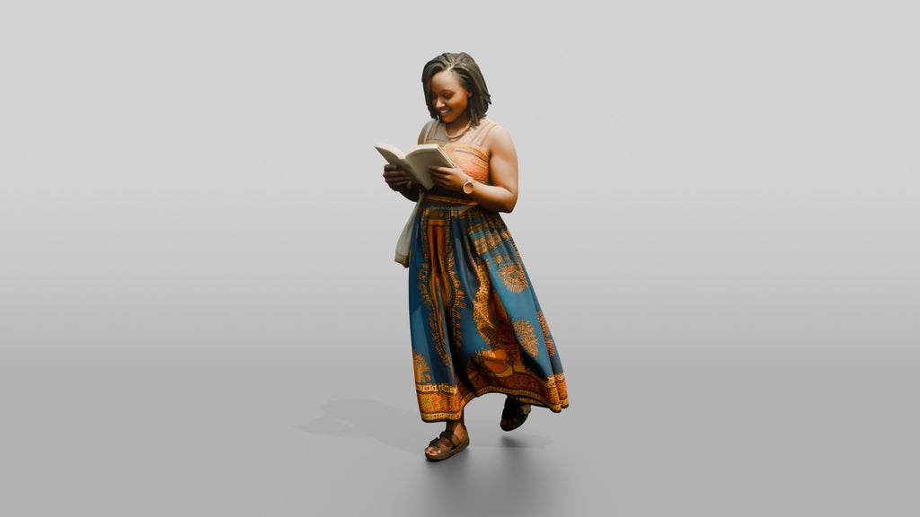 African Woman Reading a Book in a Printed Maxi Dress
