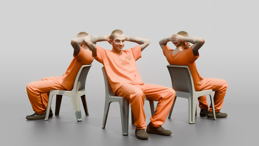 Caucasian Male Prisoner Leaning Back in a Hard Plastic Chair