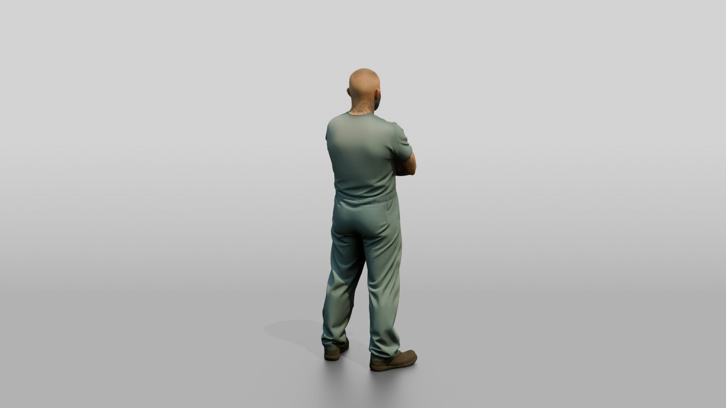 White Male Prisoner Standing with His Arms Crossed Defensively