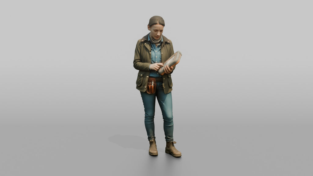 Farmer Holding Livestock Health Monitor Device