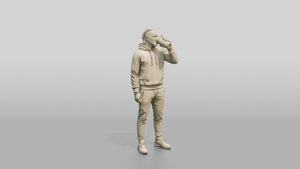 Athletic African Man Drinking Coffee in a Geometric Print Hoodie