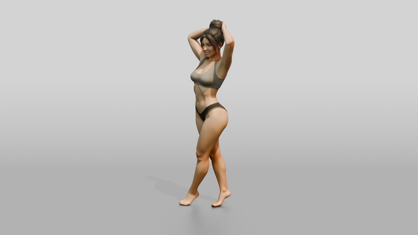 Woman in Black Two-Piece Swimsuit with Arms Raised