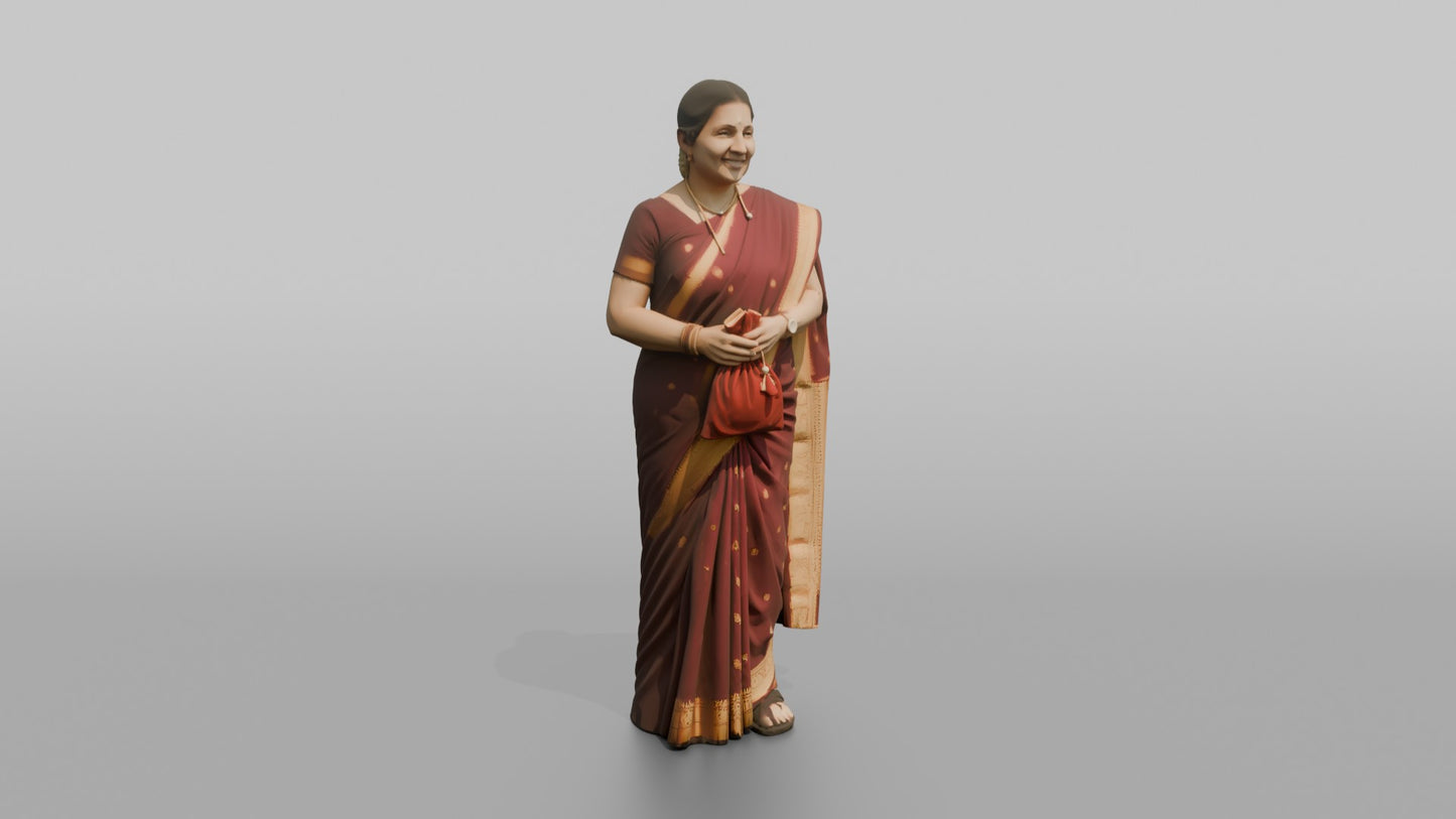 South Asian Wedding Guest Holding a Velvet Gift Pouch