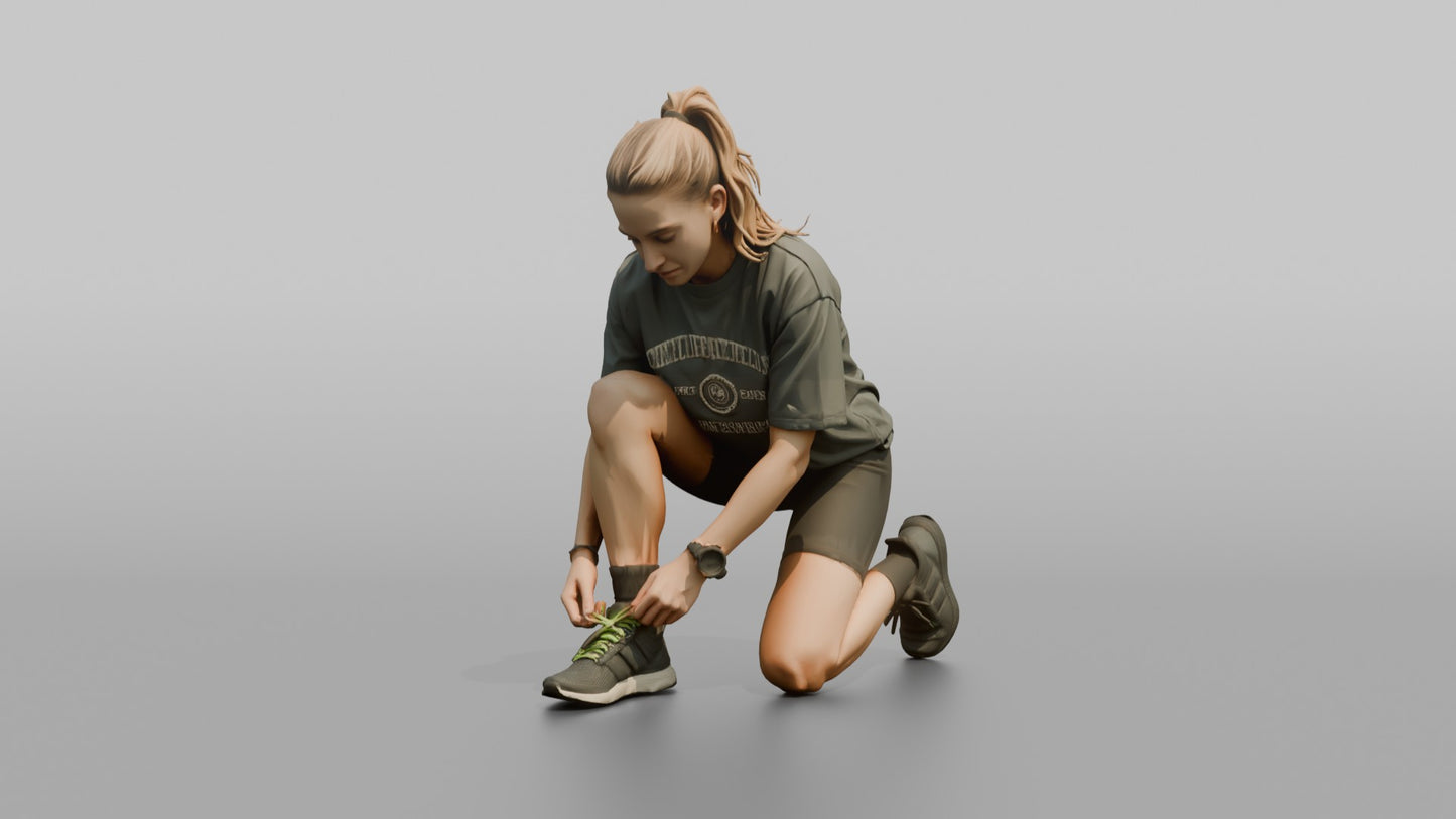 Woman Kneeling to Adjust Her Sneaker Laces