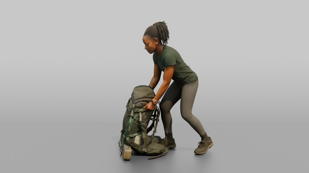 Backpacker Lowering Her Pack to the Ground