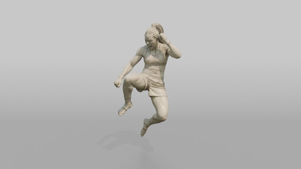 Fighter Jumping Knee Toward the Camera