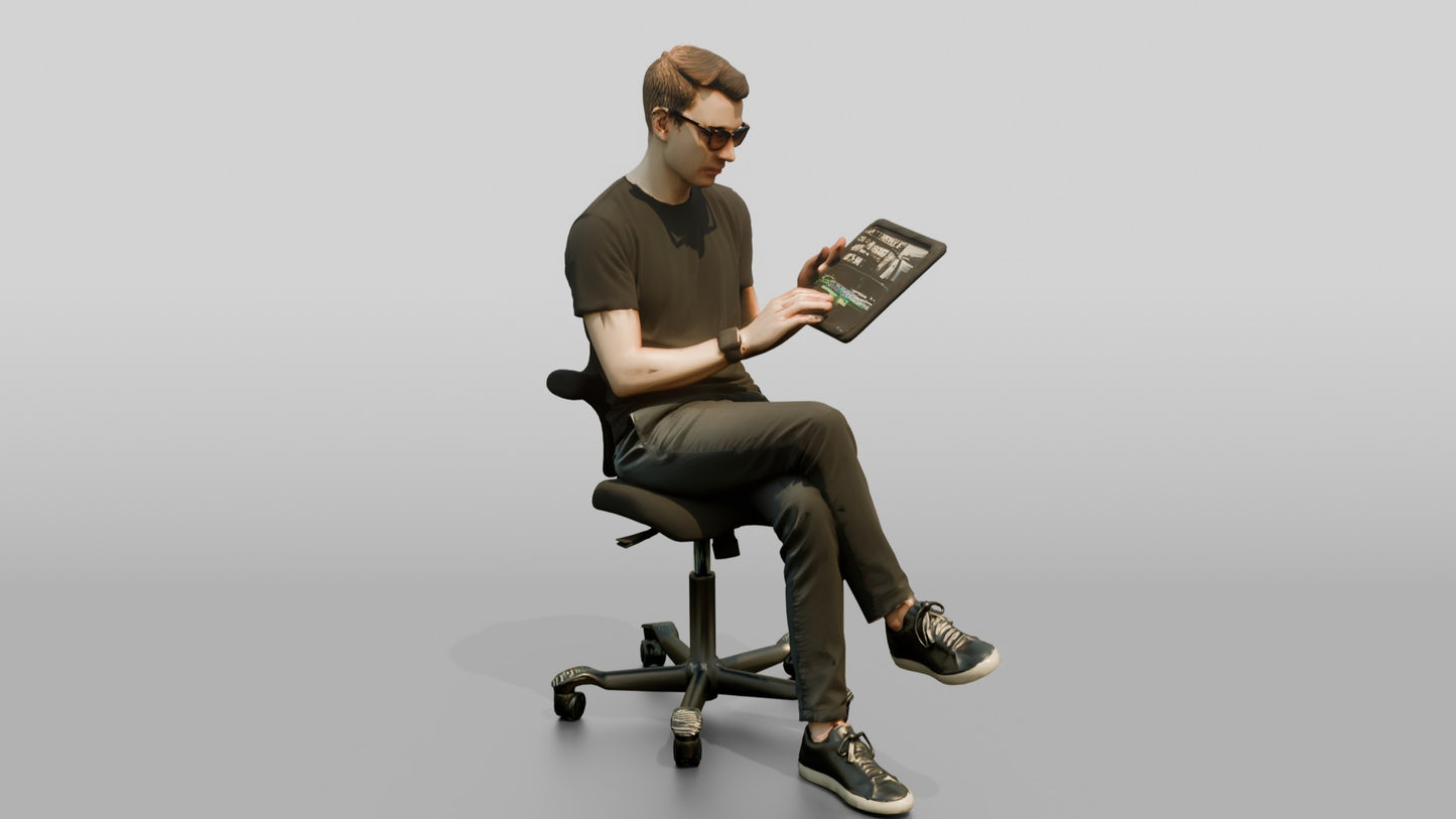 Man Seated with a Tablet and Glasses