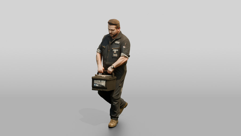 Mechanic Carrying a Car Battery
