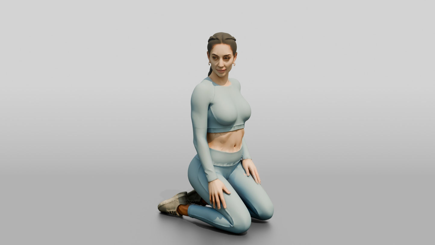 Woman Kneeling in Dusty Blue Long-Sleeve Activewear