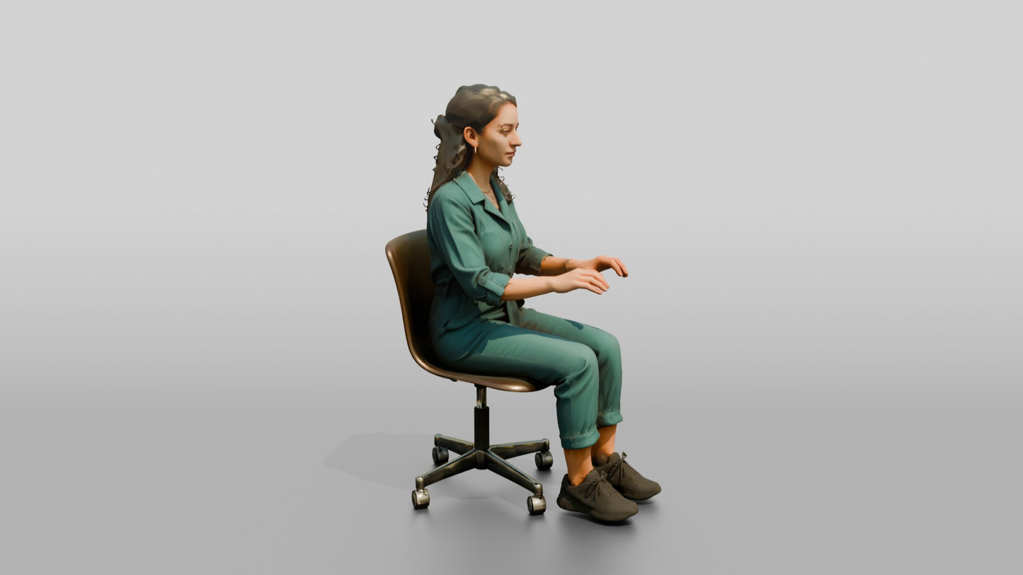 Woman Seated in a Teal Jumpsuit