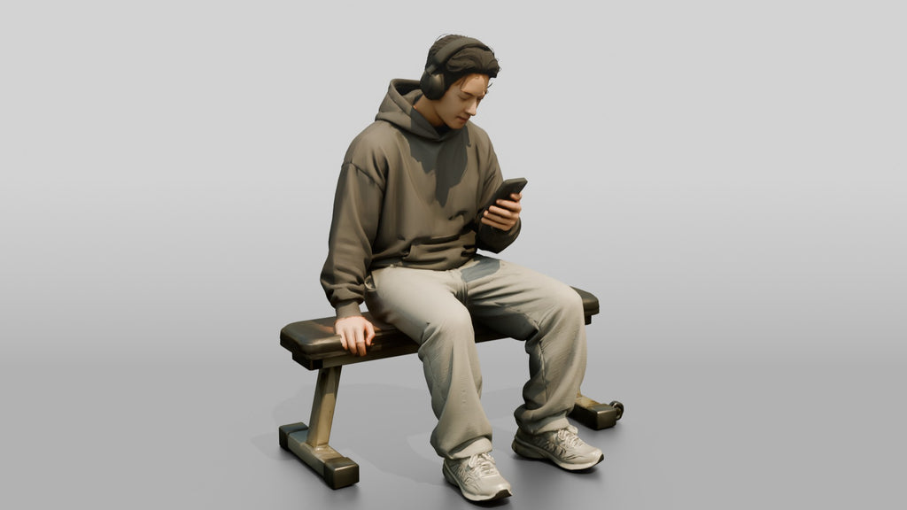 Man Sitting Checking Smartphone