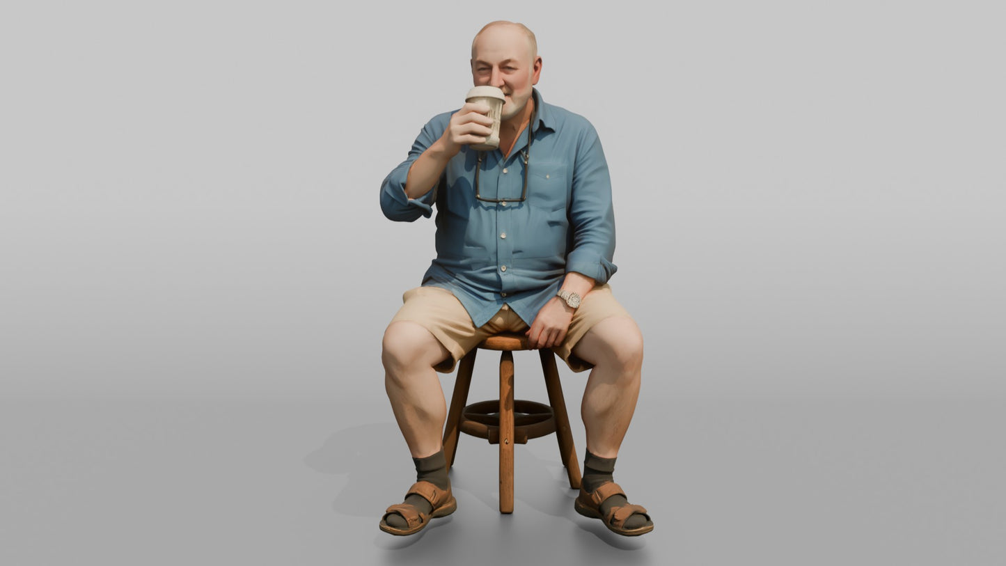 British Man Sitting with a Takeaway Coffee