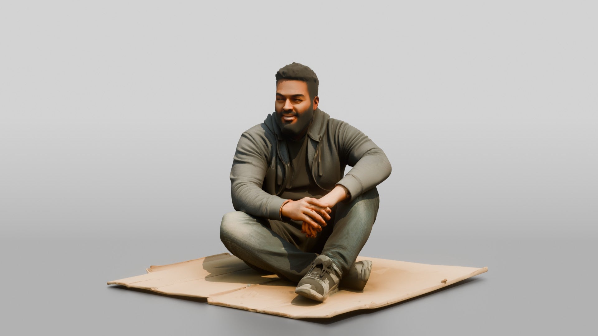 Homeless Man Sitting Flat on a Piece of Cardboard