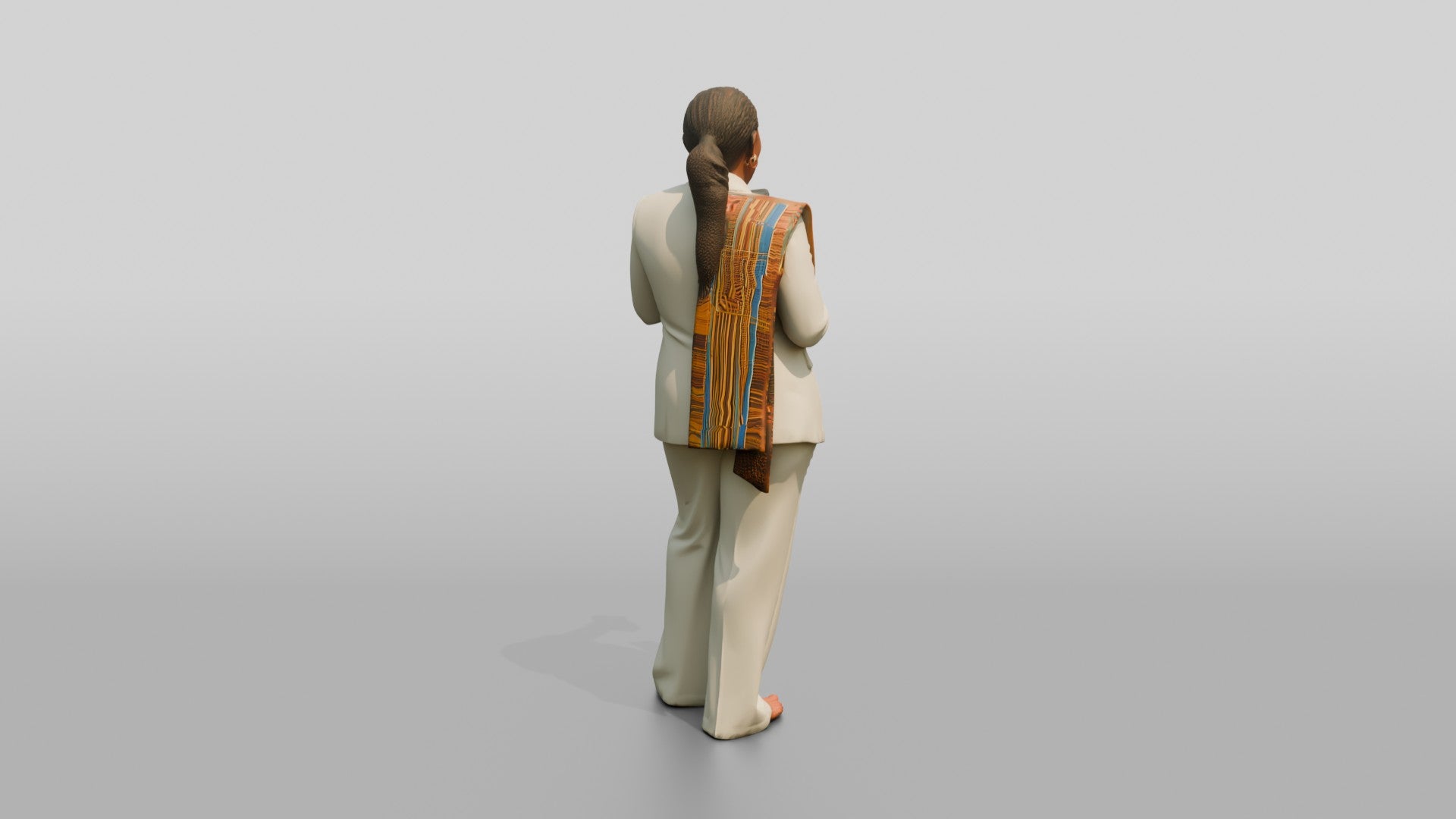 African Woman in a White Pantsuit Laughing at Her Phone