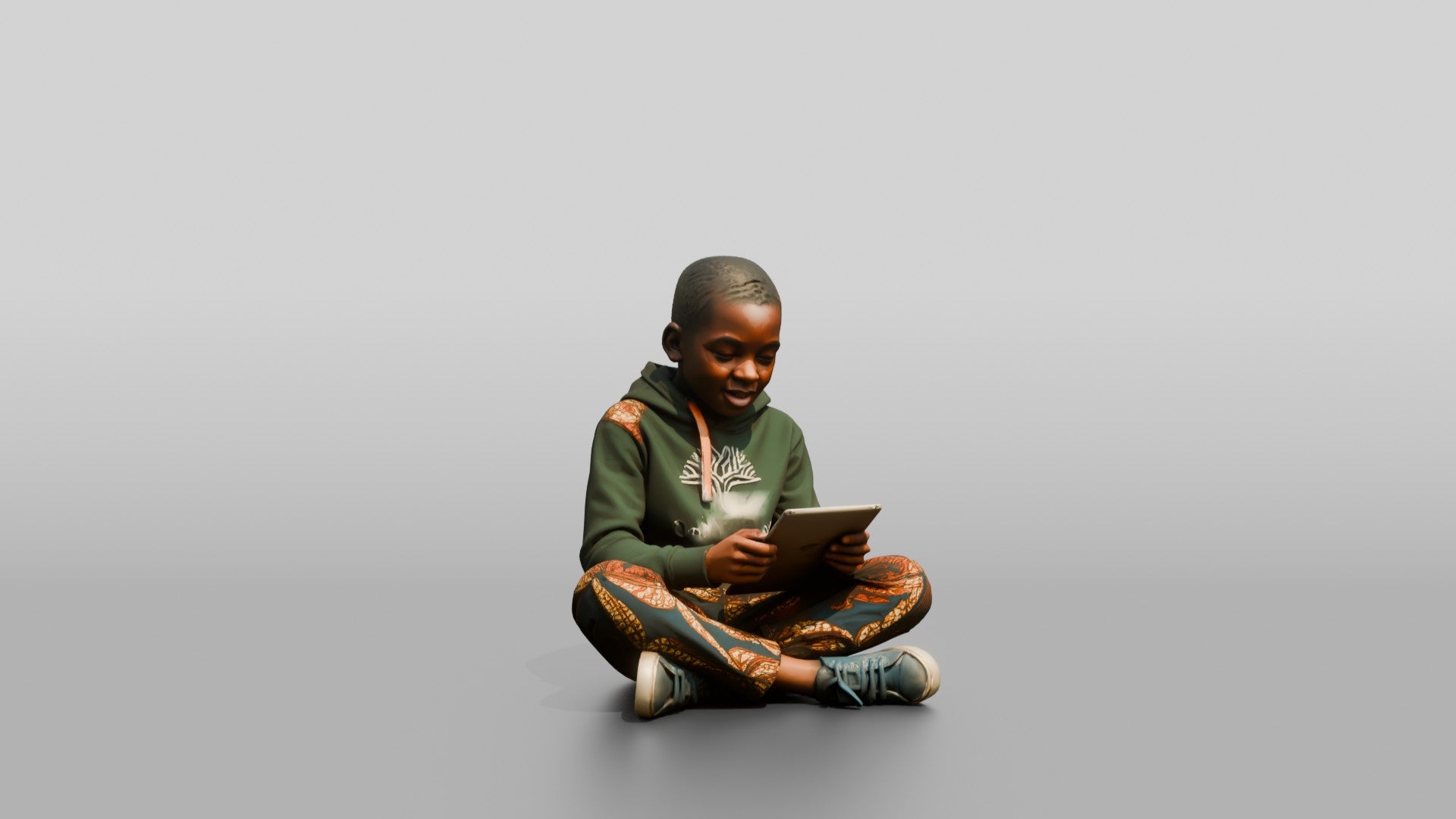 African Boy Sitting Cross-Legged with a Tablet