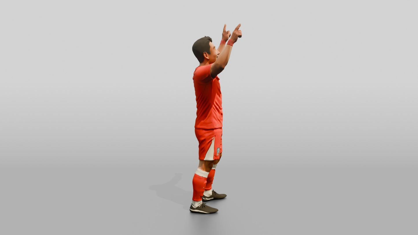 Soccer Player Pointing to the Sky