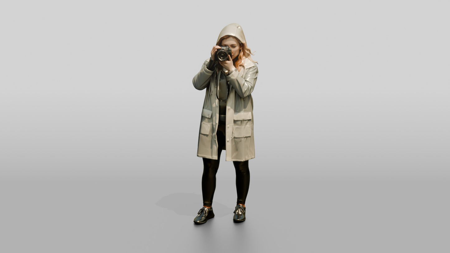 White Woman in Poncho Taking a Photo