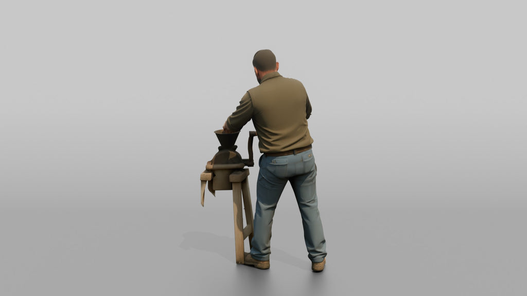 Farmer Operating Hand Cranked Corn Sheller