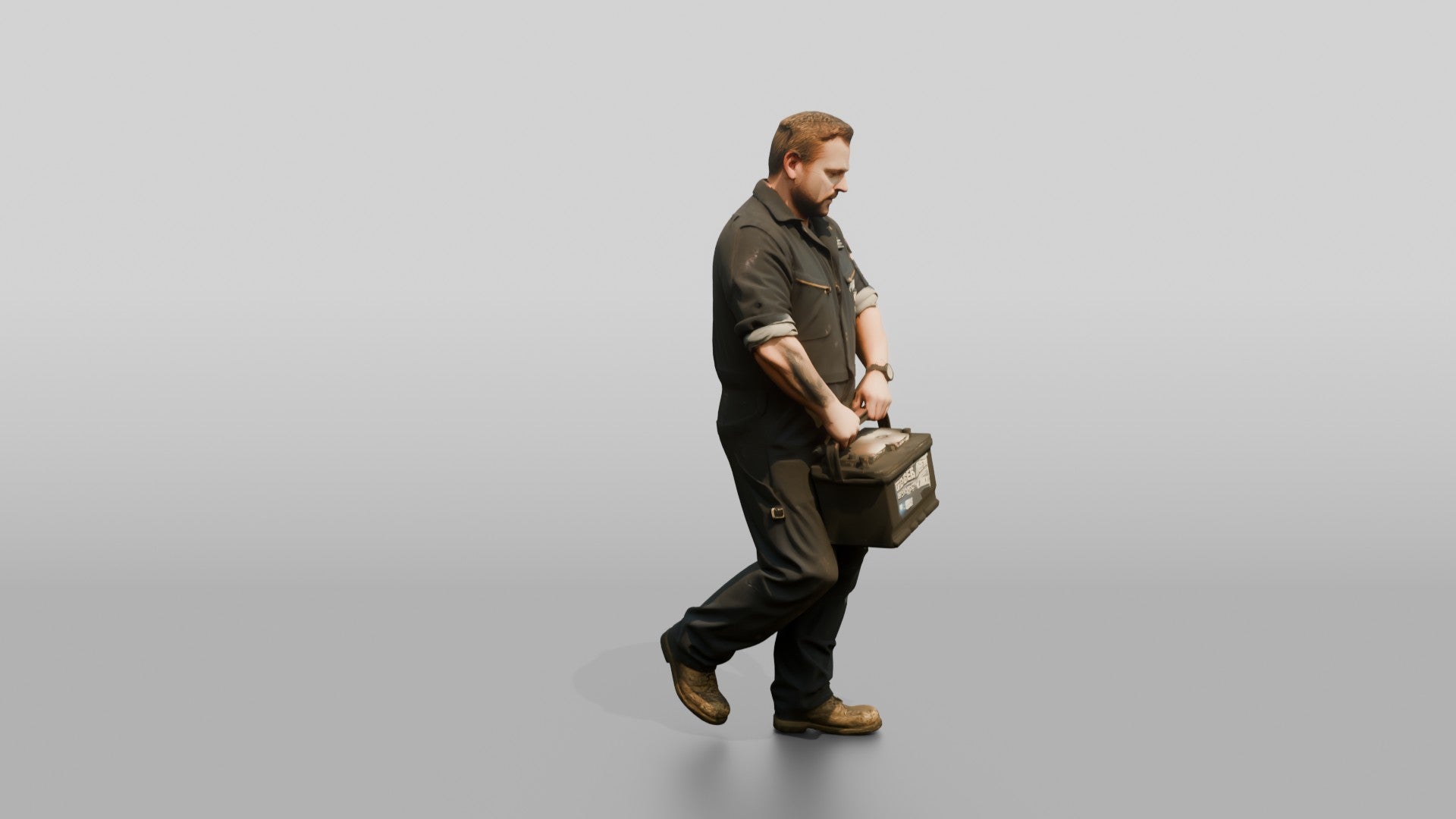 Mechanic Carrying a Car Battery