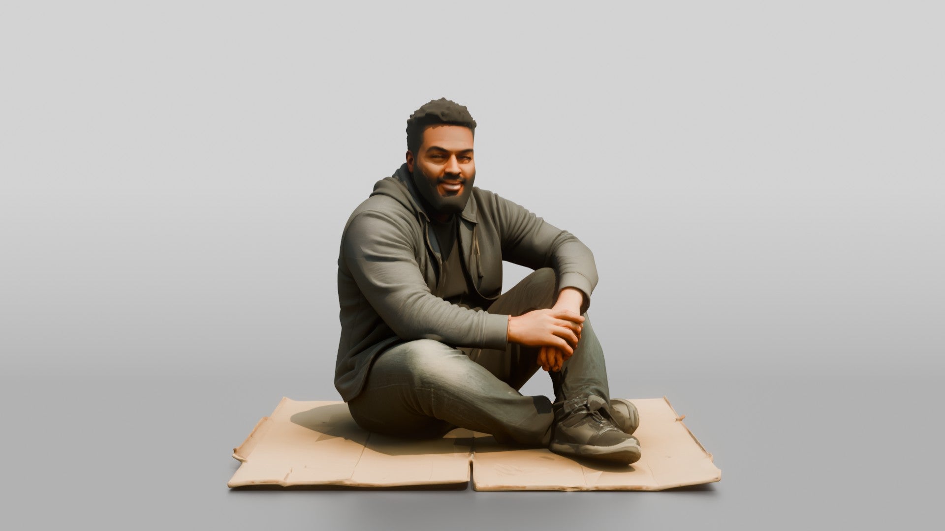 Homeless Man Sitting Flat on a Piece of Cardboard