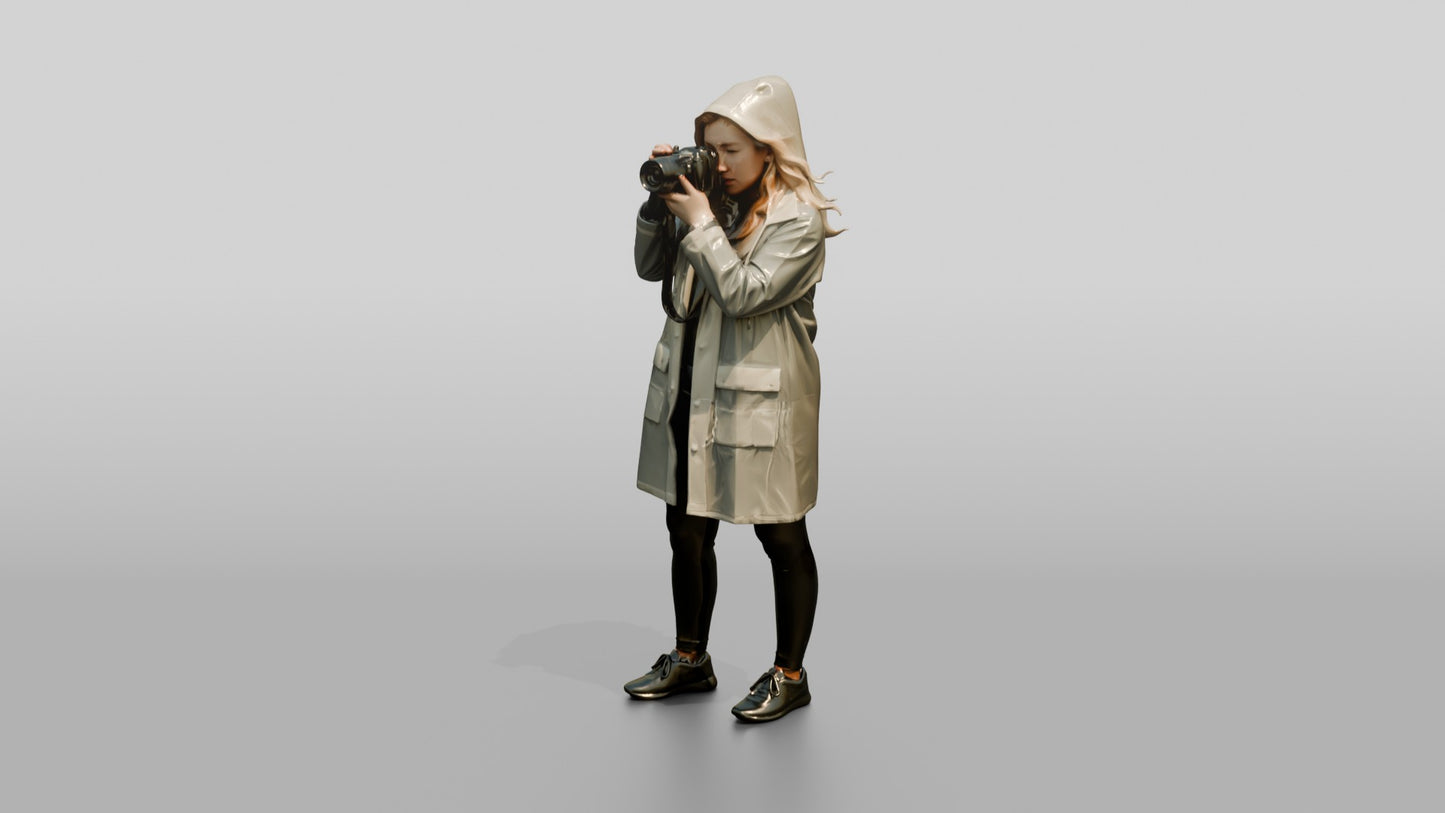 White Woman in Poncho Taking a Photo