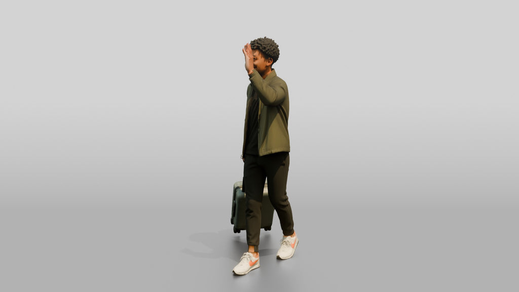 Young Black Man Waving and Smiling Pulling Rolling Suitcase