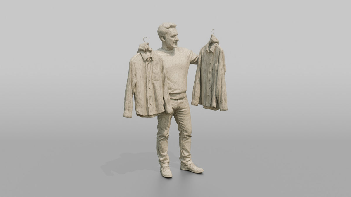 Man Customer Holding Two Shirts Up For Comparison - wireframe topology preview