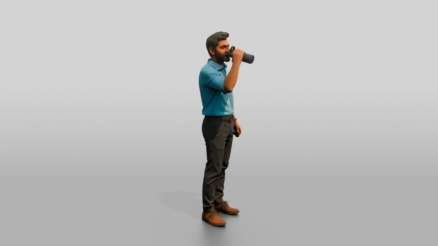 Man Sipping Coffee in a Blue Shirt