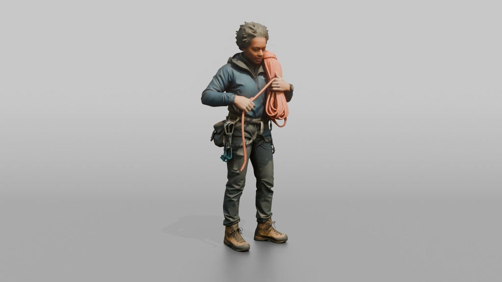 Climber Coiling a Rope Over Her Shoulder