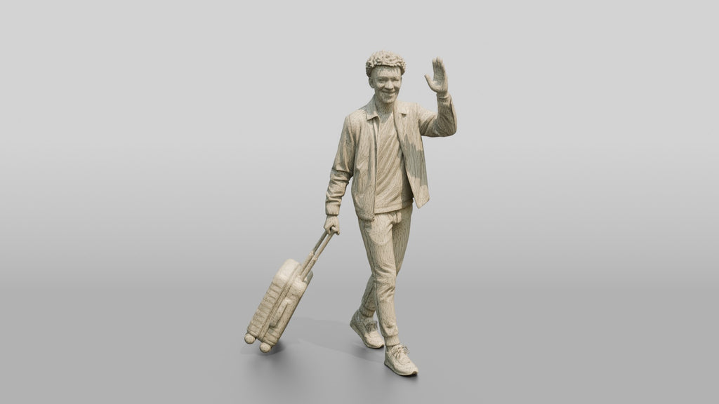 Young Black Man Waving and Smiling Pulling Rolling Suitcase