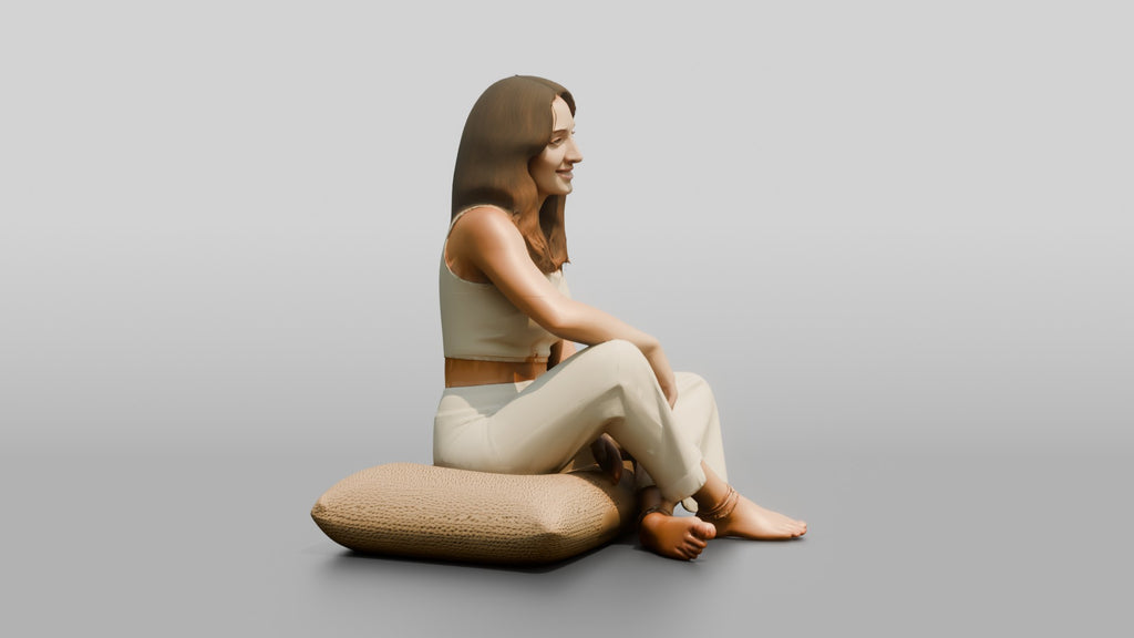 Woman Sitting Cross-Legged on a Cushion