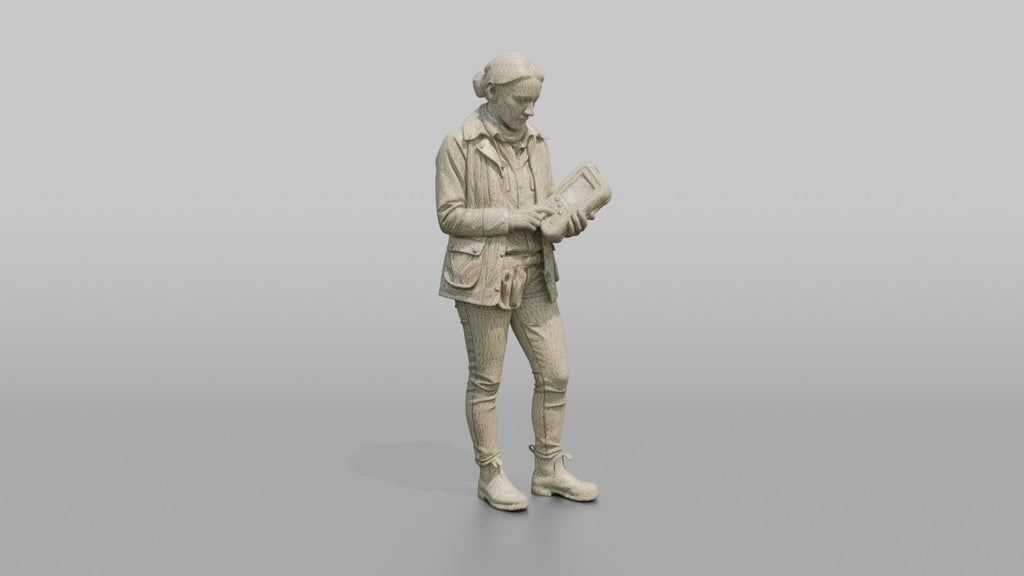 Farmer Holding Livestock Health Monitor Device