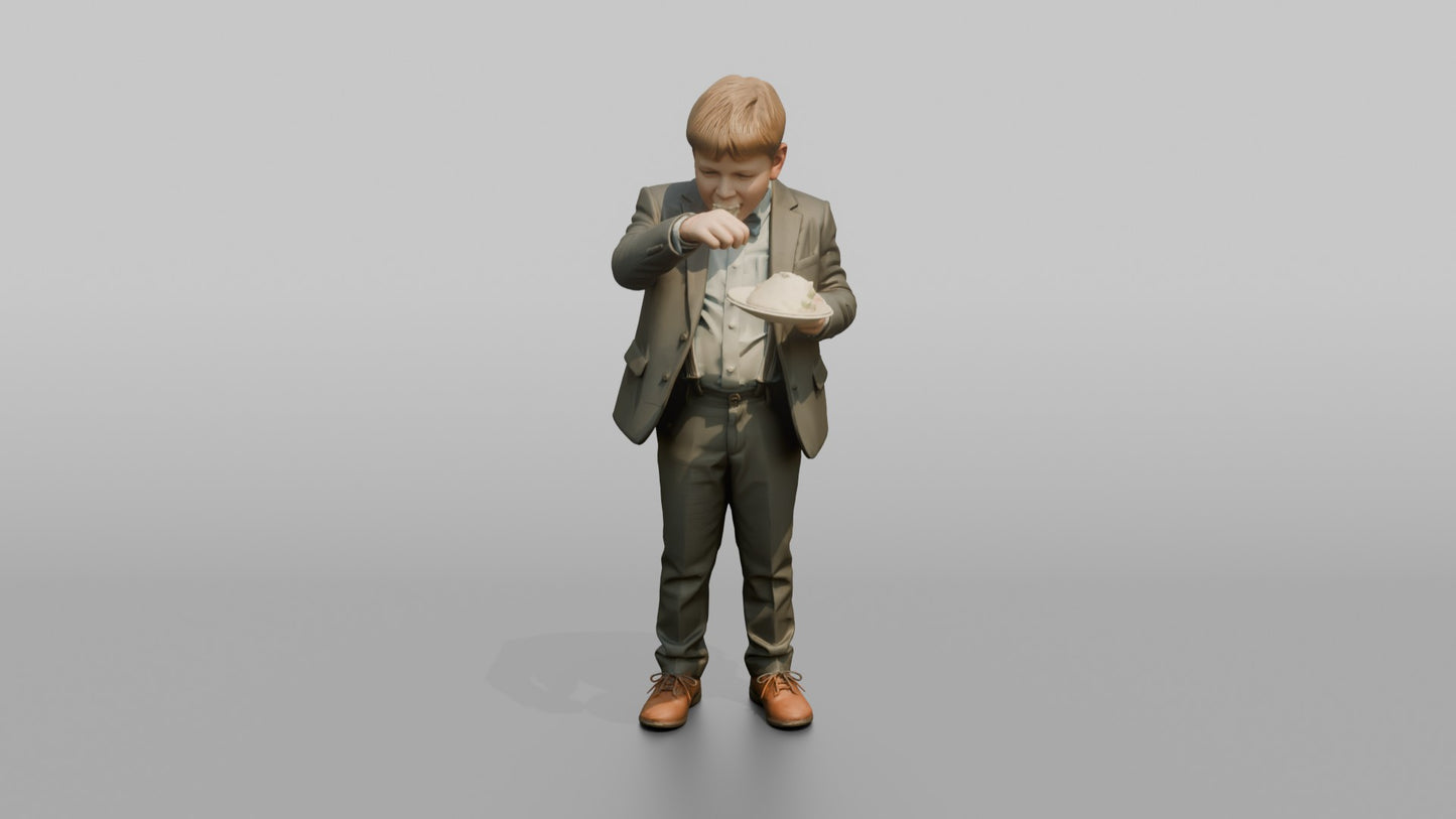 Young Boy Eating a Slice of Wedding Cake
