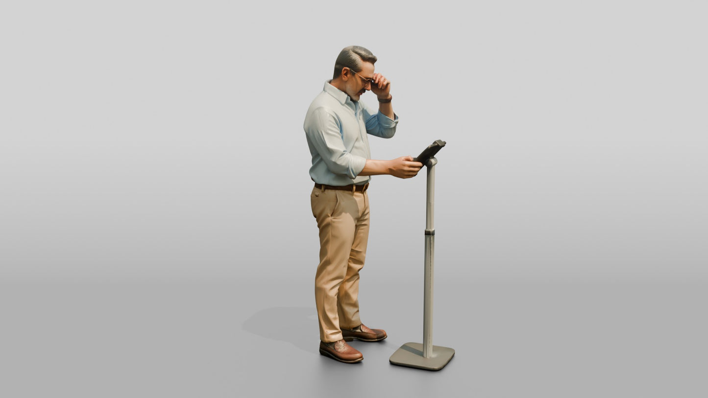 Businessman at a Standing Desk with a Tablet