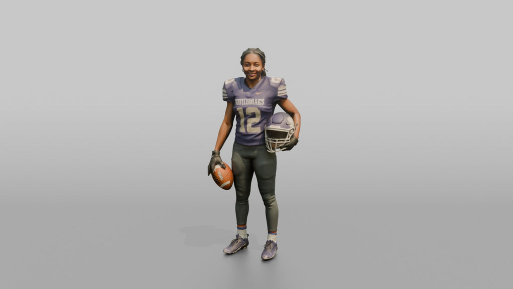 Wide Receiver Standing with the Ball at Her Side