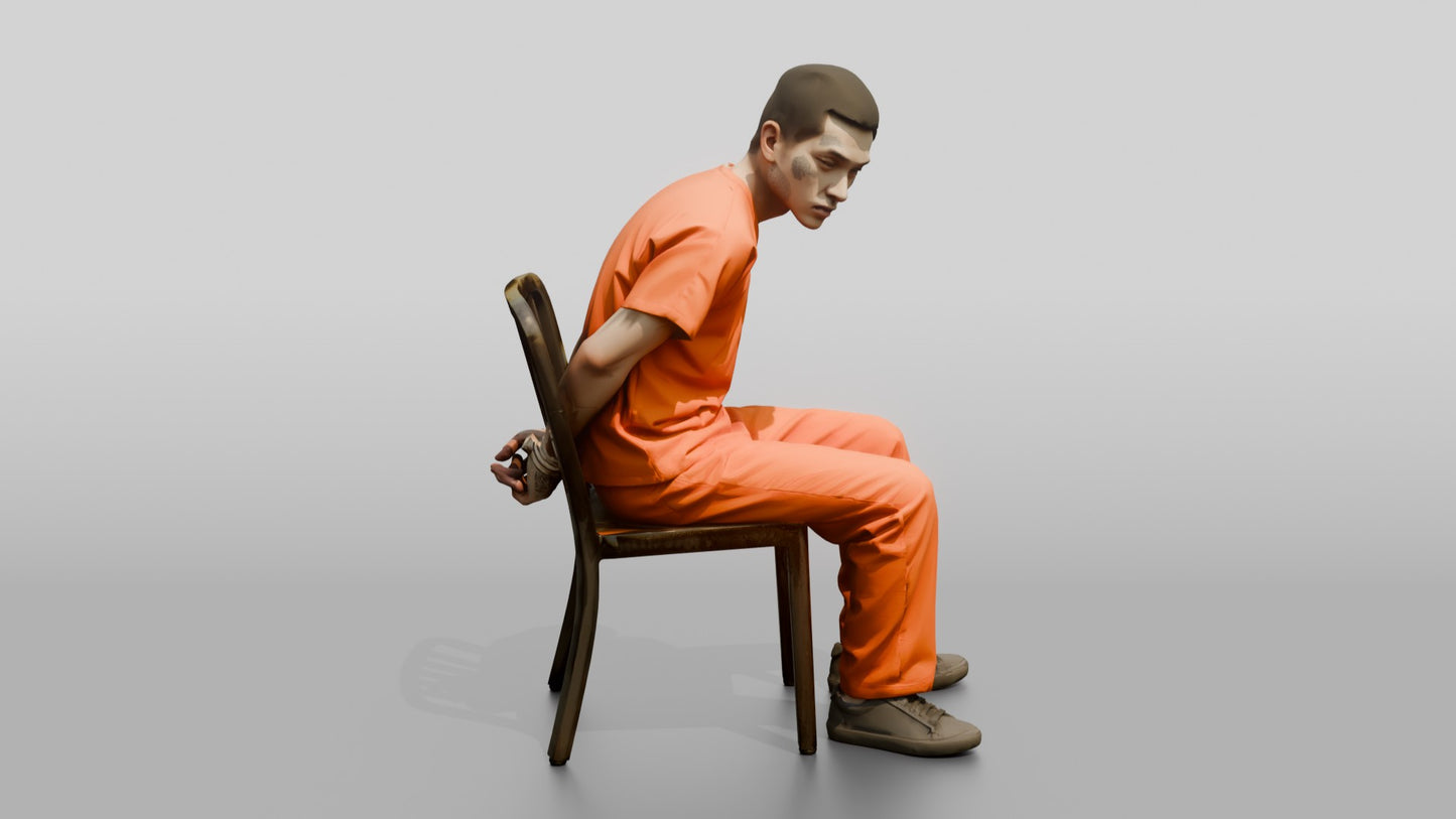 East Asian Male Prisoner Sitting Slouched in a Metal Chair