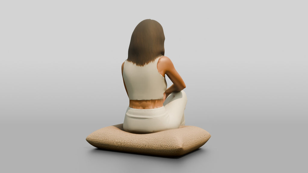 Woman Sitting Cross-Legged on a Cushion