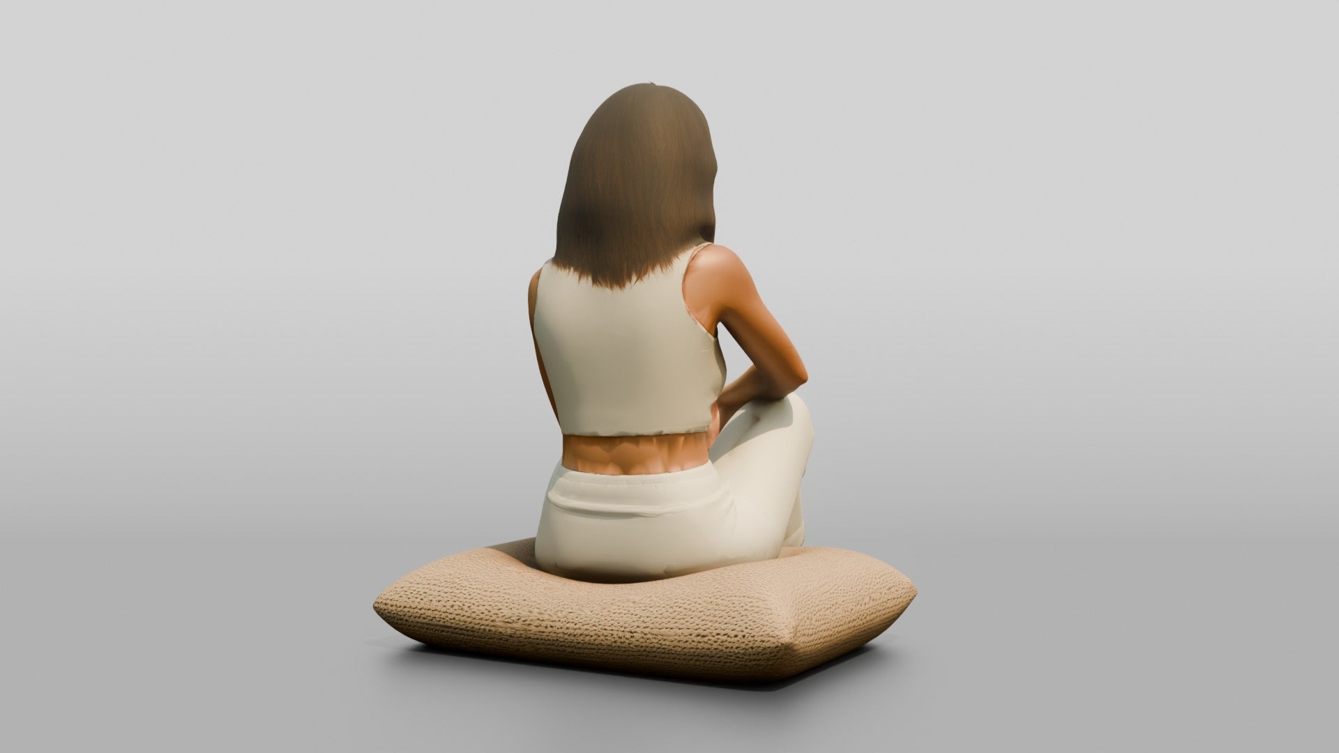Woman Sitting Cross-Legged on a Cushion