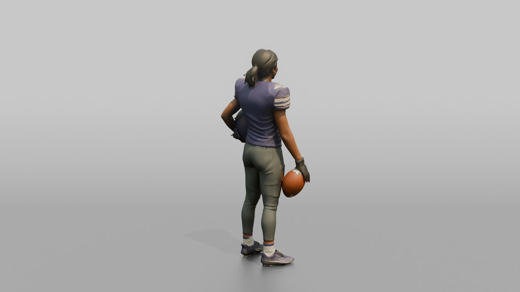 Wide Receiver Standing with the Ball at Her Side