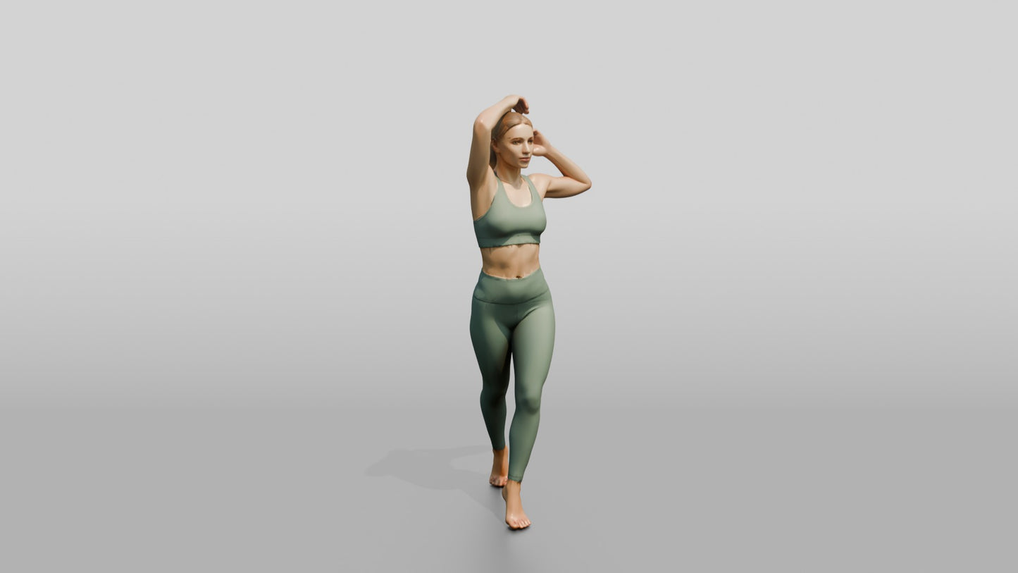 Blonde Woman Tying Her Ponytail in Sage Activewear
