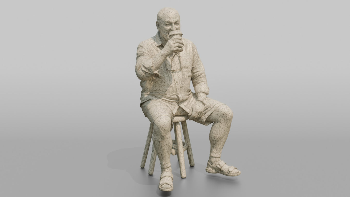 British Man Sitting with a Takeaway Coffee