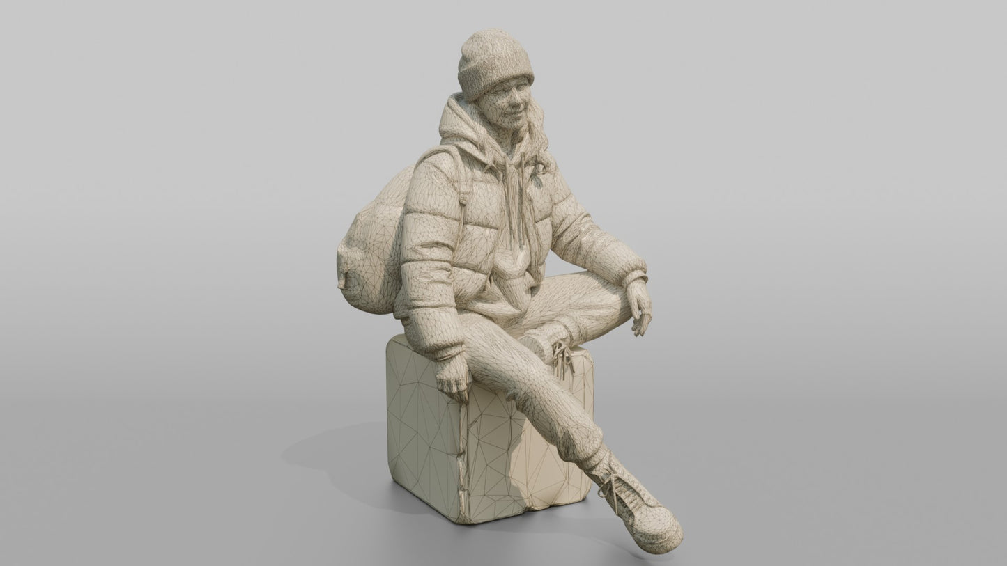 Woman Sitting in a Cropped Puffer Jacket