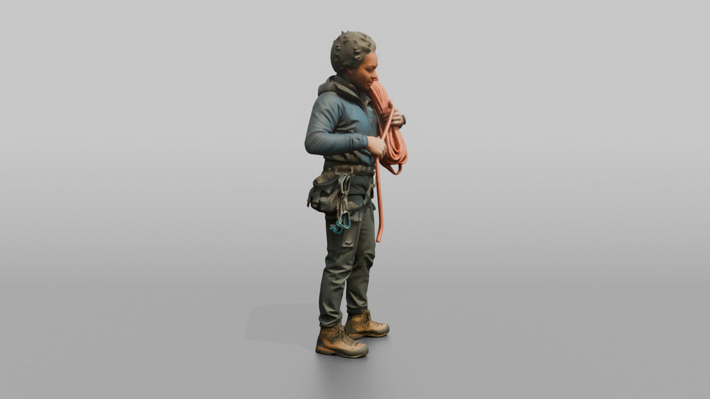 Climber Coiling a Rope Over Her Shoulder